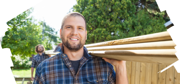 2 men carrying wooden beam