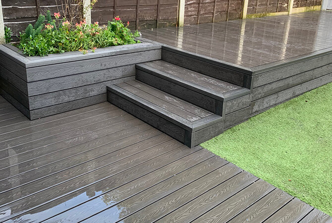 Silver ash composite decking steps with planter
