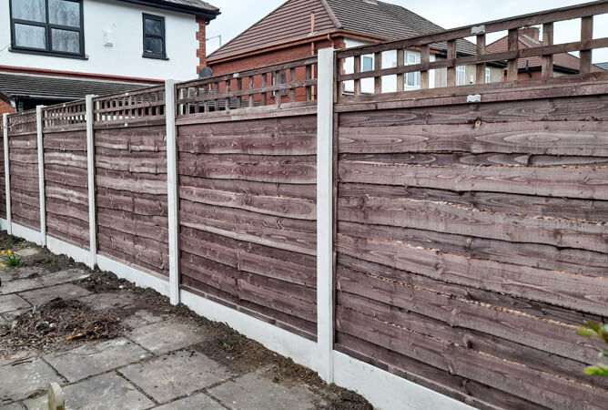 4 inch gap trellis on top of waney lap fencing