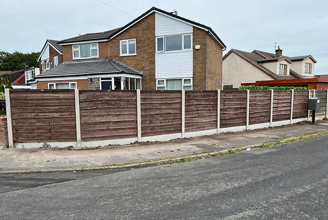 heavy duty waney lap fence panels in new concrete posts and bases