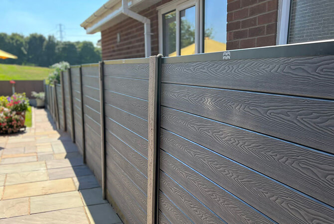 Silver ash composite fencing running the length of the customer's garden