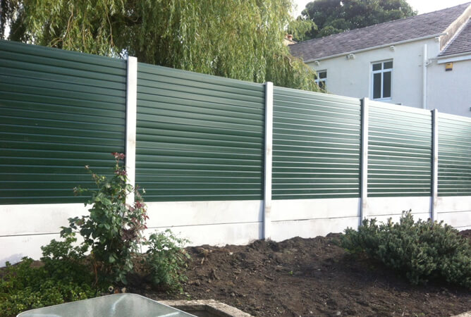 Gloss UPVC green fencing in brand new concrete posts & bases