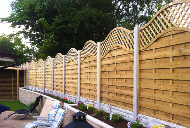 Continental omega lattice top fence panels in concrete posts & bases
