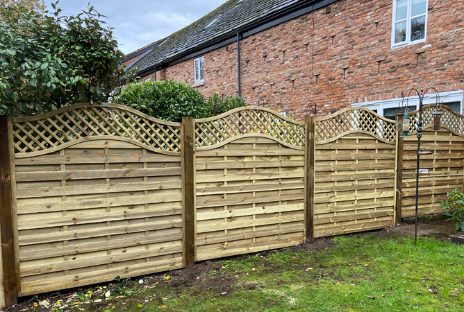 Omega lattice top fence panels with timber posts
