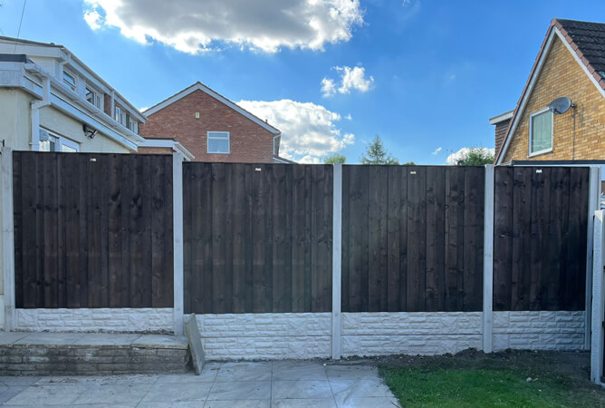 Stone faced concrete gravel boards with turret fence panels