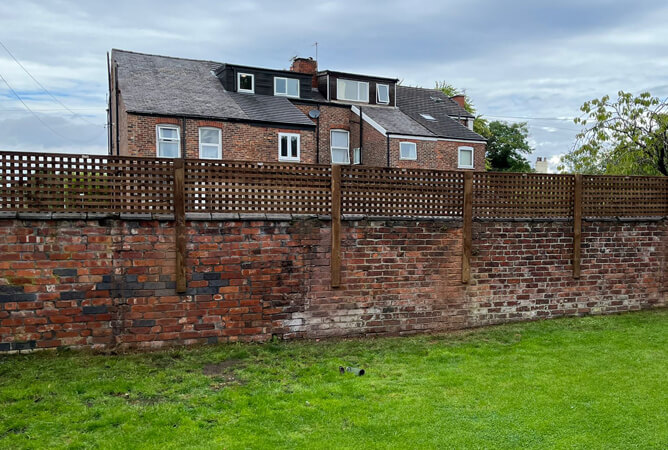 Super heavy trellis on top of a wall