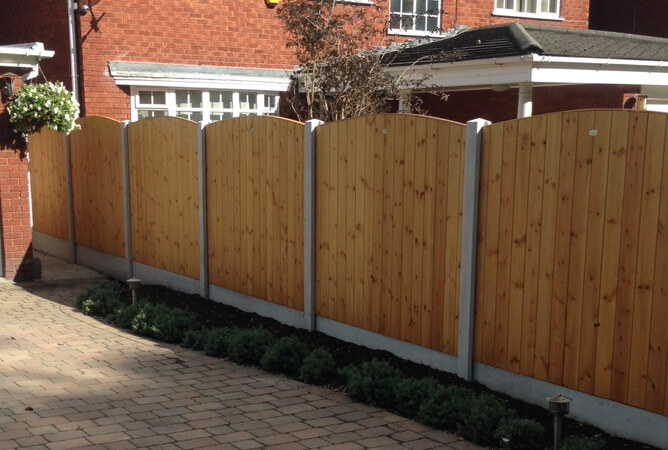 Tongue & Groove pressure treated fencing with a bow top