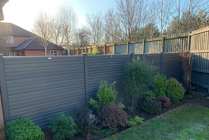 Carbon grey composite fencing with a premium top