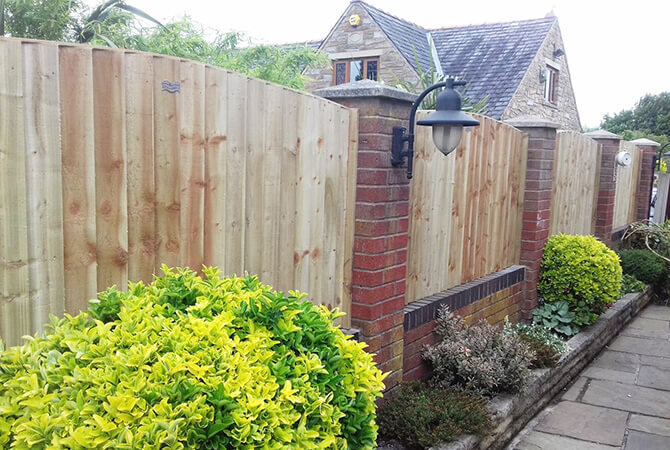 Pressure treated vertical lap fence panels