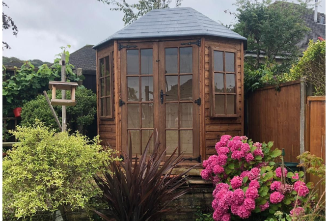 Oakdale 8 sided summerhouse treated in our dark brown oil based treatment