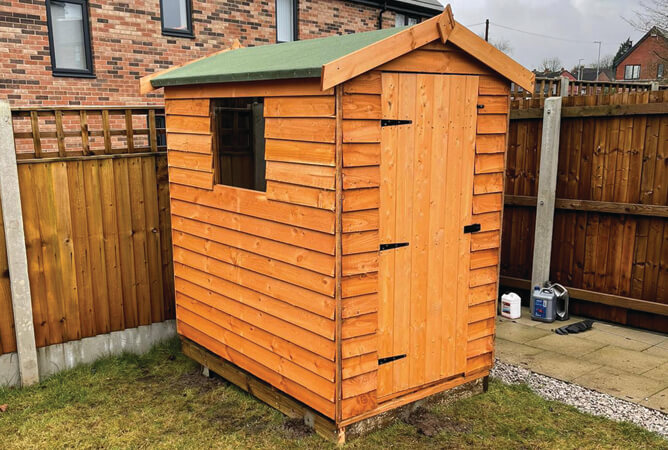 Timber Cottage shed treated in golden brown