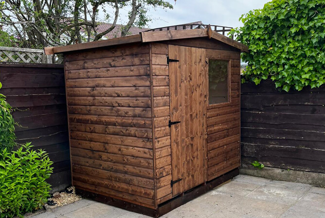 Dart 7x5ft shed treated in Dark Brown