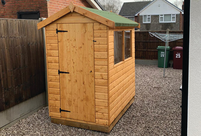 6ft x 4ft Norfolk timber shed treated in golden brown