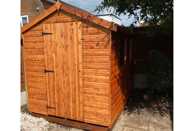8ft x 6ft Norfolk shed treated in Summer Tan