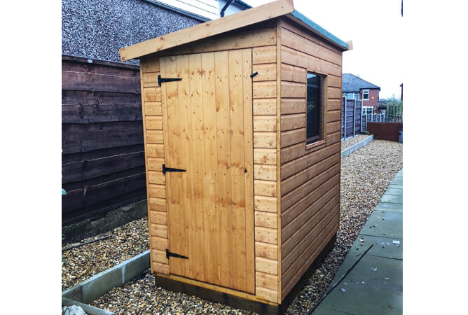 Suffolk pent roof shed treated in golden brown