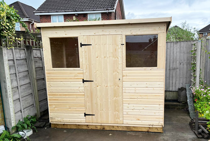 Suffolk 8ft x 6ft shed with a clear oil based treatment