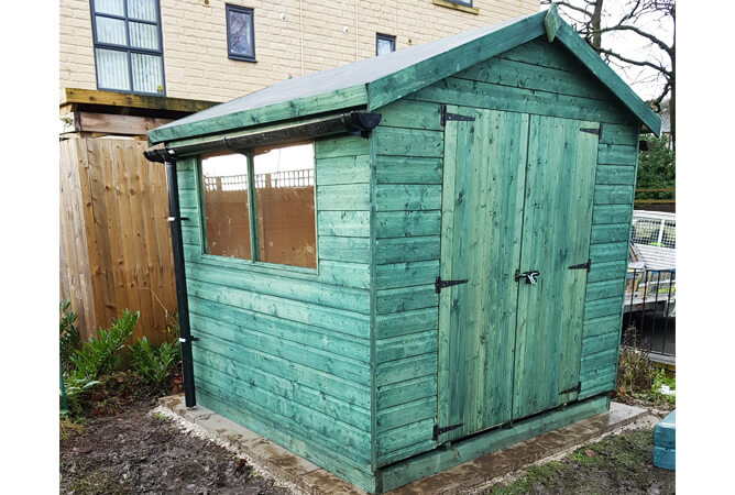 Double door Surrey shed treated in Holly Green