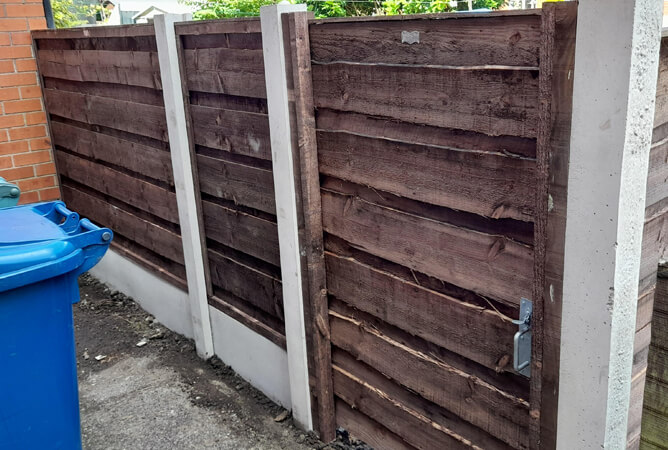 Custom sized waney gate to match the garden fencing